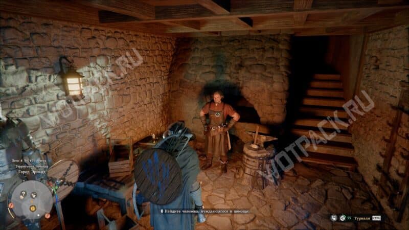 Кузнец Эрнанд стоит перед печью