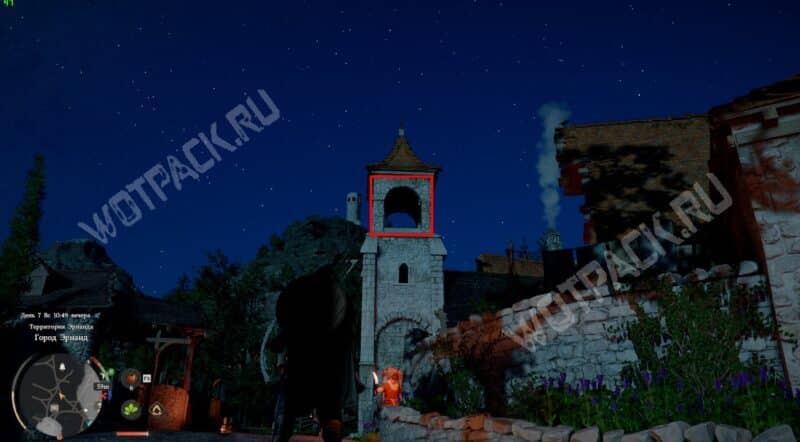 Высокая колокольня у дерева в Эрнанде